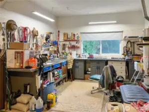 Work shop area in spacious garage.