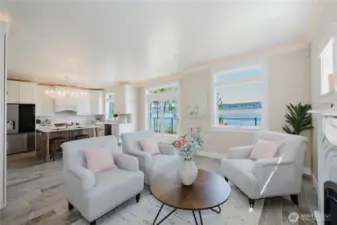 Living room open to the kitchen , views from every window and access to the huge deck. Ceramic tile floors throughout.