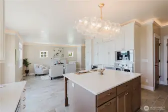 Partial view of the kitchen and living room on the main floor.