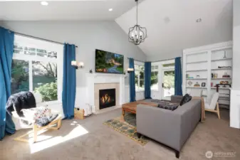 Luxurious Primary Suite offers a fireside living room & library with a walk-out deck and patio.
