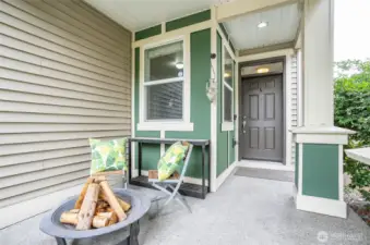 Spacious and welcoming covered front patio, perfect for relaxing evenings or entertaining guests.