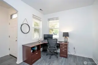 Located just off the entryway, this spacious and adaptable room offers endless possibilities—ideal for a home office, library, cozy sitting area, or customized to fit your lifestyle.