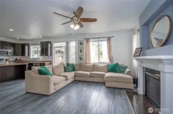 The family room seamlessly connects to the kitchen, ensuring the chef stays part of the fun. A glass slider opens to the outdoor patio and fully fenced backyard for easy indoor-outdoor living.