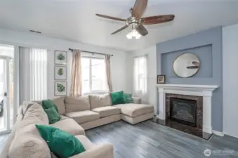 The family room offers a cozy retreat with a gas fireplace—perfect for chilly PNW days.