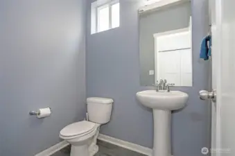 Conveniently located main-level powder room for guests and everyday use.