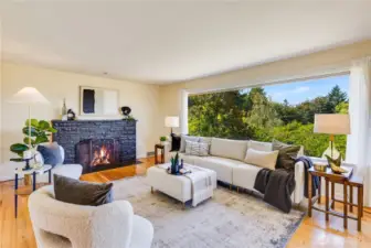 The home’s ideal location on a gently sloping hill affords serene, beautiful views of Northwest trees through every window!