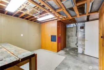 Adjacent to the laundry room is this workshop room. Notice the classic workbench and outlets above counter level.