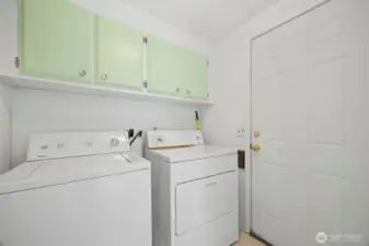 Mudroom with a door leading out to the side of the house.