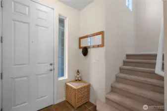Entrance with ceramic tile.
