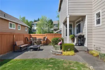 Backyard that features an upgraded extended patio and garden space.