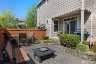 Backyard that features an upgraded extended patio and garden space.