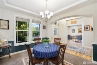Formal dining with inset ceilings and crown moulding