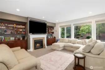 Living room with gas fireplace and custom shelving