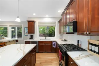 Spacious kitchen with dark cabinetry