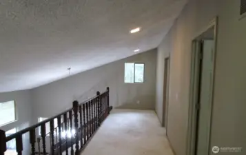 Loft outside the first bedroom, nice open space.