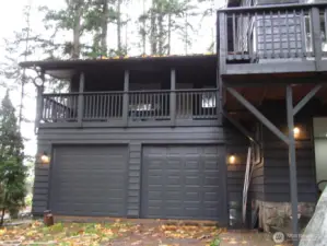 Primary bedroom is located above the garage with a covered deck all to yourself, however it is a wrap around deck that goes around the entire front and side of the home.