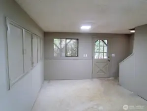 Bonus room number one is located at the bottom of the stairs and has its own entry.