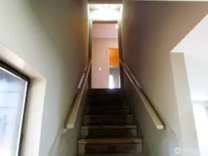 Staircase to go back up the stairs, kitchen is off to the right at the top of the stairs.