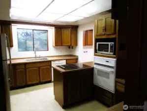 Nice size kitchen, with a new sink and pipes.