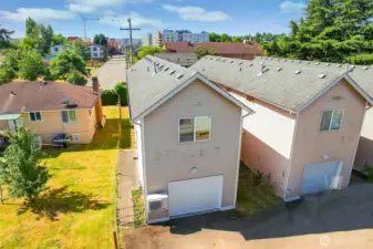 View from the back of the house with a garage door entrance into the kitchen area
