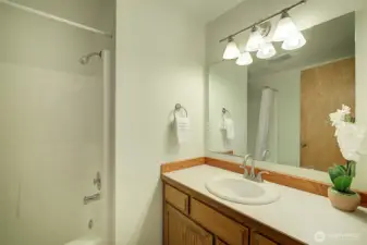 Main bath in upstairs hallway.