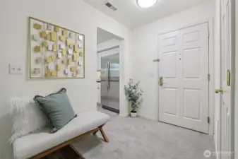 Light and Bright foyer with coat closet and room for bench