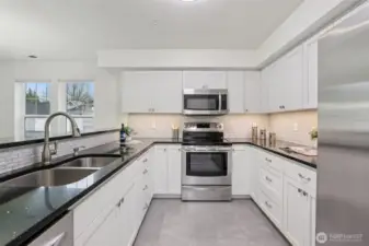 Newer kitchen, new flooring and light.