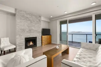 A Full height stone surround enhances to modern look of the gas fireplace.