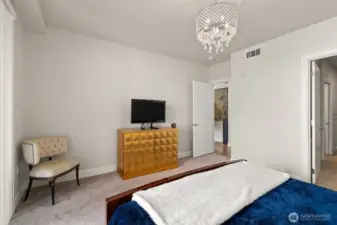 The 'spa' bath off the primary suite is the door on the far right... the entry door into the primary bedroom is from a foyer off the living area. Bedroom and bath doors are solid core minimizing noise transfer making life nice and quiet for you.