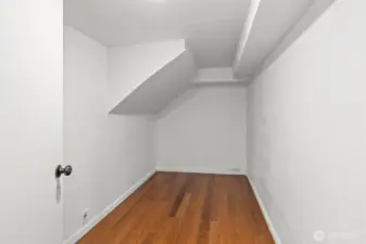 Large finished room across from Office/Den behind wet bar downstairs.