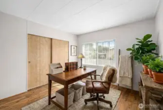 Third bedroom virtually staged as an office space. This room is close in size to second bedroom. Can be utilized however you'd like!