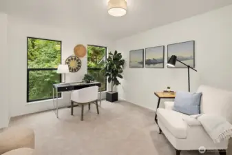 Flexible main floor den or guest room with tranquil greenbelt views and convenient access to the beautifully renovated ¾ bath