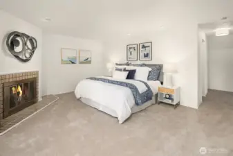 Private upper-level primary retreat featuring a fireplace and an expansive, serene layout.