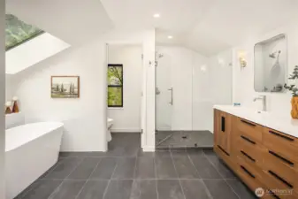 Completely reimagined in 2026, this spa-inspired primary bath features a freestanding soaking tub, oversized glass shower, and modern double vanity