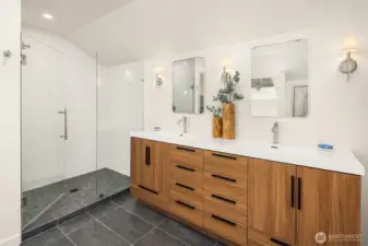 Completely reconfigured in 2026, the spa-inspired primary bath pairs clean modern lines with an oversized glass walk-in shower and sleek double vanity for a refined, contemporary retreat