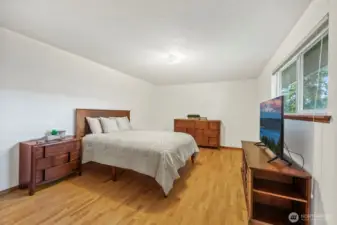 Primary suite is oversized, real hardwood floors