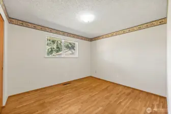 Bedroom 1 with hardwood floors
