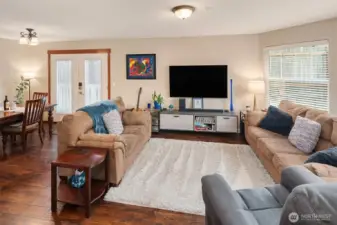 Warm and inviting, this area allows for relaxing, imaginative furniture layout options, and room for activities. The french doors lead to the accessible ramp or to the secluded patio. :)