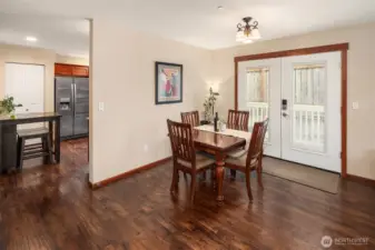 Versatile dining area opens up with double french doors with not a neighbor to be seen. Back corner ambience is the best!