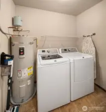 Convenient laundry room upstairs simplifies wash days in this two-story home.