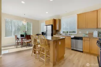 Light-filled kitchen with eat-in nook and open flow to the living room