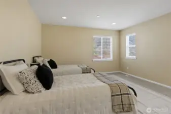 Well-sized bedroom easily accommodating dual twin beds