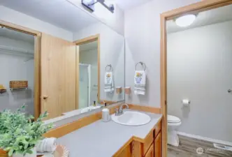Bathroom with walk in closet in the primary bedroom