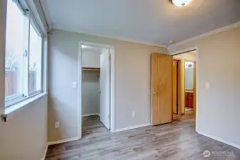 Another view of 2nd bedroom looking towards the walk in closet and hallway