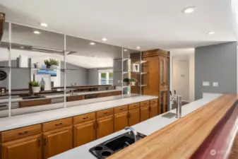 What a bar which includes sink, kegerator, mini frig, dishwasher, ice maker and tons of counterspace and cabinets. Makes for easy entertaining for any size crowd
