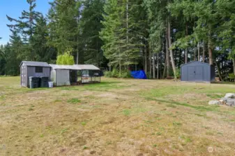 Chicken coop with power and outbuildings. This property offers the perfect spot to build your dream shop.