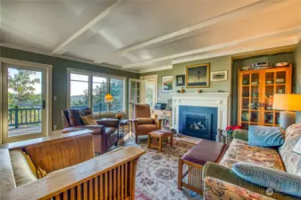 This view shows the new fireplace insert and door to the deck. Note: all furnishings are negotiable.