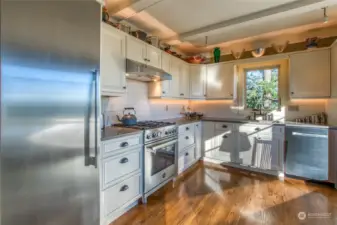 2018 remodel included new cabinets, quartz counters and appliances including the Bertazzoni propane range and a 23" Thermador refrigerator. Note the fridge does not include a freezer. The owners use an upright freezer in the garage, but if your buyer wants a freezer closer to the kitchen, an option could be to add an outlet in the pantry