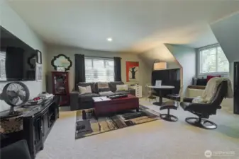 Bonus room with a closet and attic storage. Could be a 4th bedroom.