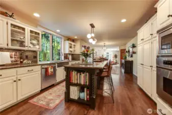 Simply gorgeous expansive kitchen. Solid hardwood floors, stainless steel appliances, granite counter tops, full backsplash, center island and work station.